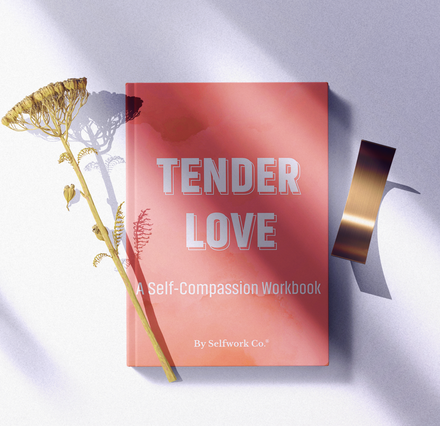 Styled shot of SelfWork Co.'s Tender Love workbook placed with dried florals and ribbon, lit by soft natural shadows