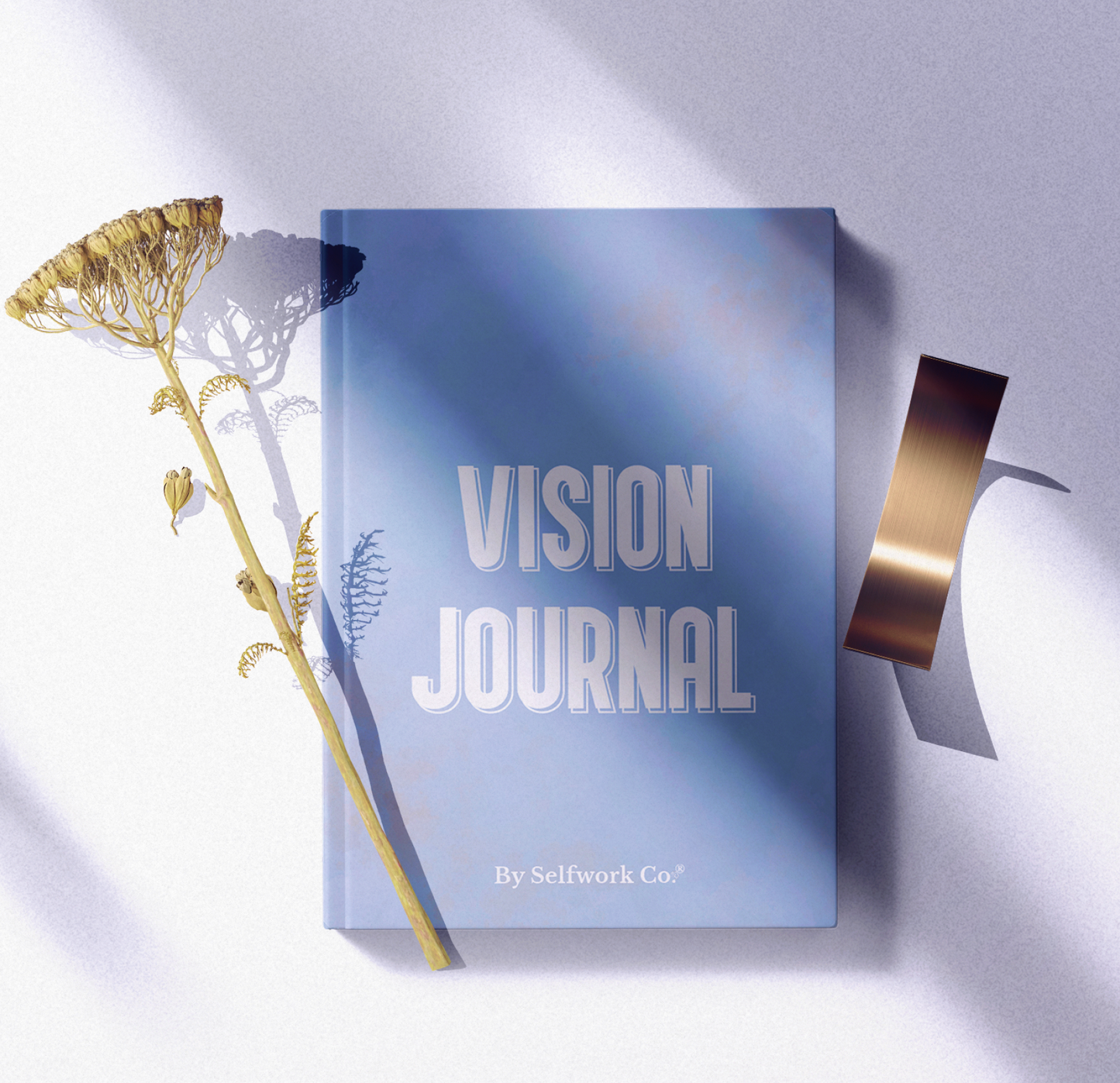 Flat lay of SelfWork Co. Vision Journal hardcover with natural lighting, dried flowers, and ribbon props