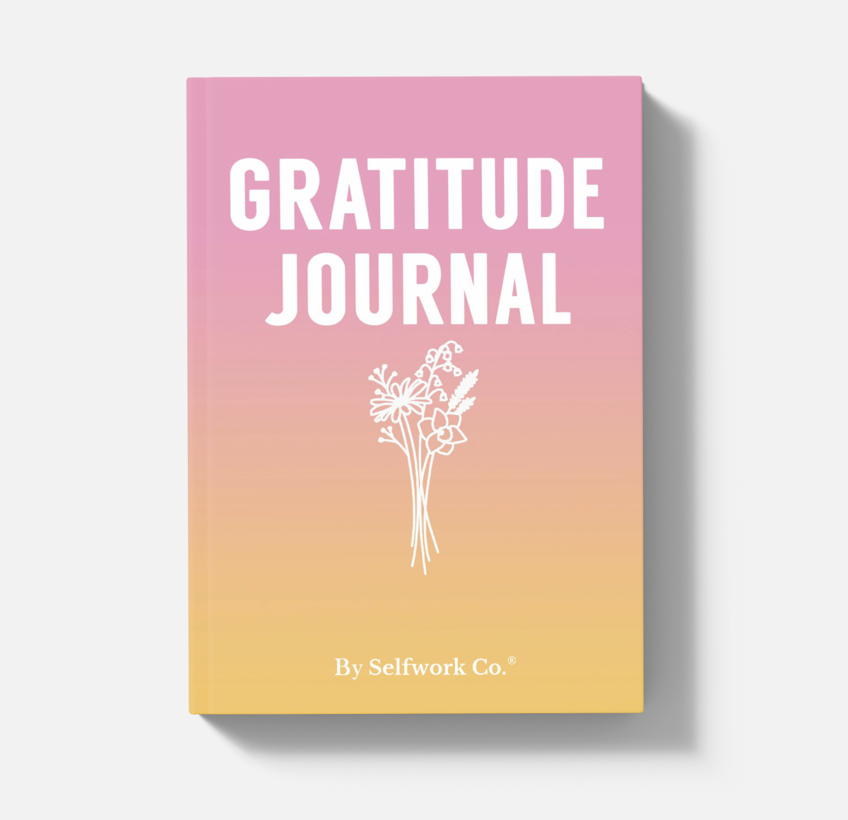 SelfWork Co. Gratitude Journal hardcover with pink and yellow gradient cover and floral illustration