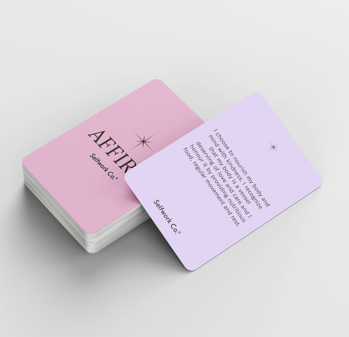 Stack of pastel-toned AFFIRM cards from SelfWork Co. with the visible card out of the deck focusing on positive body image and self-care messaging, ideal for mental wellbeing routines