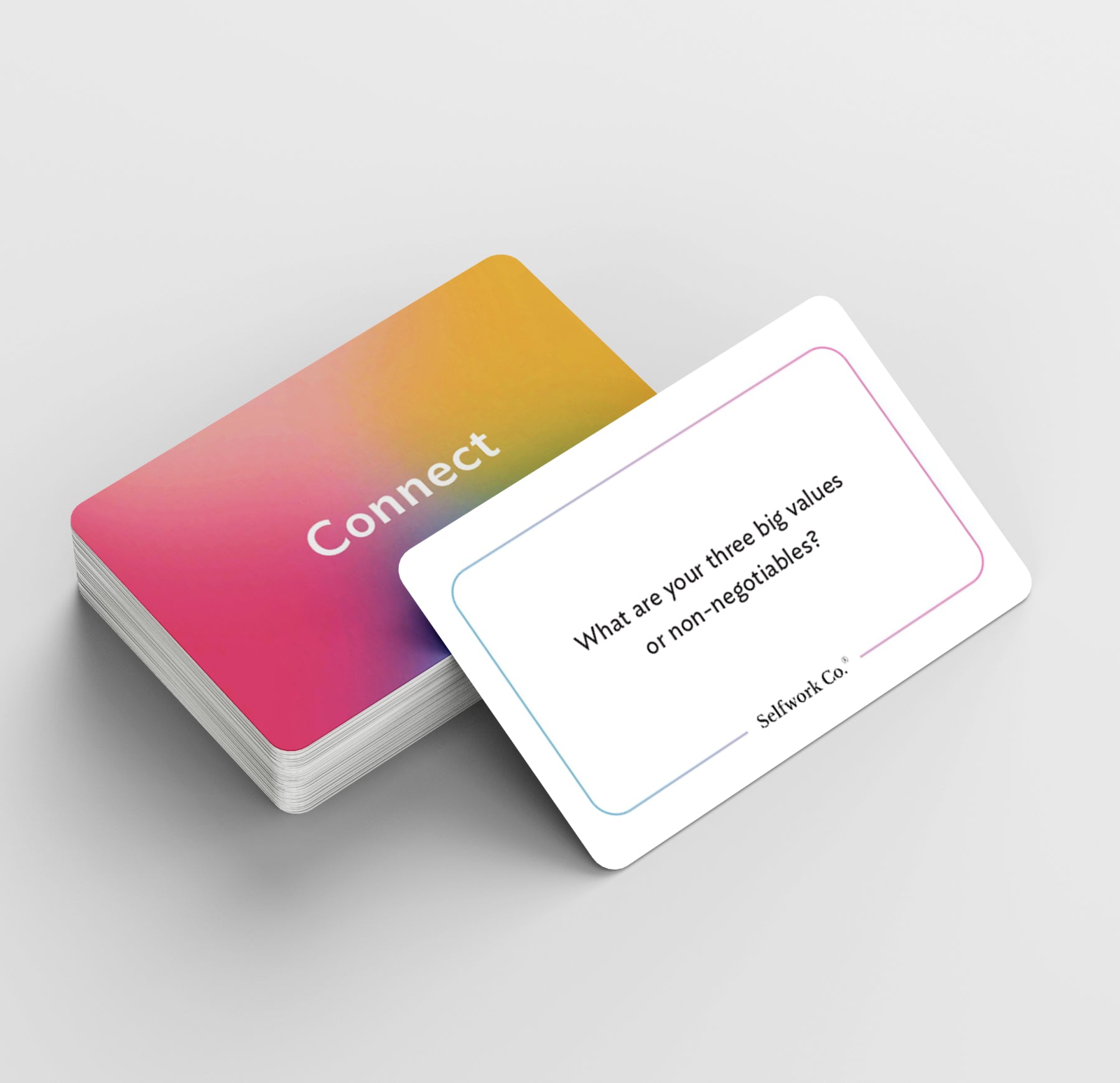 SelfWork Co.'s Connect card deck showing a prompt card asking about core values, designed to inspire meaningful self-reflection and intentional conversations
