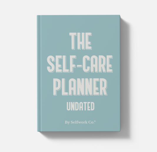 The Self-Care Planner hardcover book with calming blue cover and bold white title design