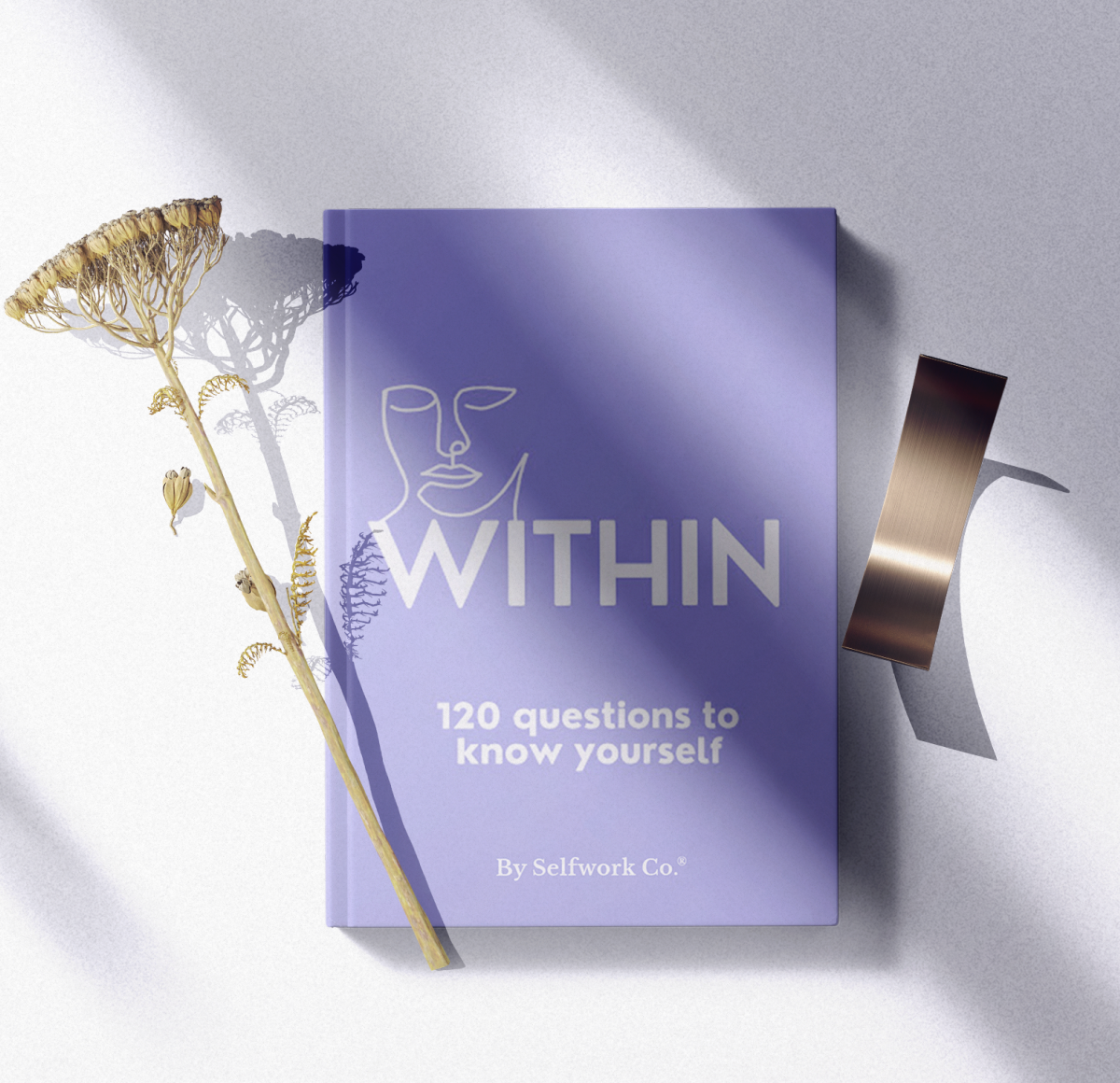  Within hardcover self-discovery journal laid flat in a calm, natural flatlay setting