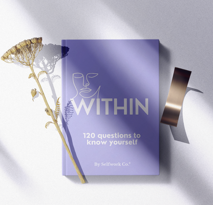 Within hardcover self-discovery journal laid flat in a calm, natural flatlay setting